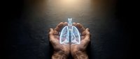 Protective hands holding glowing lungs symbol representing respiratory health, medical care and pulmonary wellness concept for healthcare design.