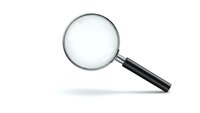 Magnifying glass with black handle isolated on white background for search, investigation, research and analysis concepts in business and science.