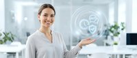 Professional businesswoman presenting digital healthcare technology interface with medical icons in modern office environment.