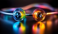 Colorful glass spheres with rainbow reflections on dark background creating mesmerizing light effects and mirror symmetry, macro photography art composition.