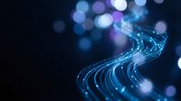 Abstract blue fiber optic cables with glowing light trails and bokeh effects on dark background for technology and communication concepts.