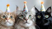 Three adorable cats wearing colorful striped party hats looking up with wide-eyed expressions, celebrating a special occasion against light background.