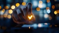 Hand touching glowing heart shape on digital screen with bokeh lights in dark background, creating magical atmosphere of love and technology connection.