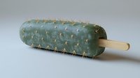 Green cactus popsicle with spines on wooden stick against white background. Creative summer dessert concept for hot weather cooling treats.