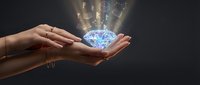 Hands protecting glowing digital brain with data streams and light effects on dark background representing artificial intelligence and technology innovation.