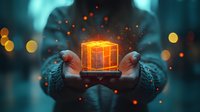 Glowing orange gift box floating between hands against dark background with magical sparkles and bokeh lights creating mystical holiday atmosphere.