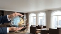 A businessman in formal attire holds a glowing digital network interface displaying connected icons above an elegant modern living room with large windows and contemporary furniture.