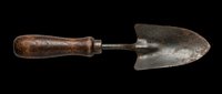 Vintage garden trowel with rustic wooden handle, isolated on transparent background. Ready for clipart, stickers, t-shirt design, print on demand, and sublimation projects.