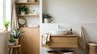 Modern minimalist bathroom interior with wooden vanity, white vessel sink, floating shelves and green plants for spa-like home design and renovation projects.
