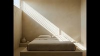 Minimalist bedroom with low platform bed and natural sunlight streaming through window, creating serene sleeping space for interior design and home decor projects.