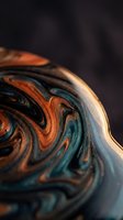 Abstract fluid art with swirling orange and teal marble patterns creating dynamic waves and curves for modern design projects.
