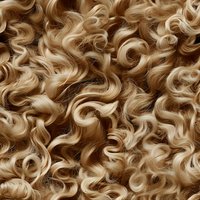 Seamless pattern of natural blonde curly hair texture with flowing waves and ringlets creates organic background for beauty and fashion designs.