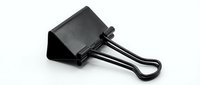 Black metal binder clip isolated on white background for office supplies and document organization needs.