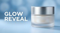Cosmetic skincare jar with metallic silver lid on blue background, moisturizer cream product display for beauty and wellness marketing.