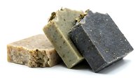 Handmade natural soap bars with herbs and botanicals for organic skincare and eco-friendly bathing routines.