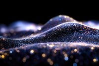 Glittering dark blue waves of particles with golden bokeh lights creating magical abstract background pattern for luxury designs and presentations.