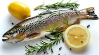 Fresh raw salmon trout with rosemary sprigs, lemon slices, and black peppercorns on white background, perfect for seafood restaurant menu or healthy cooking blogs.