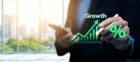 Businessman drawing green growth arrow and percentage symbol on virtual screen in modern office environment for financial success concepts.