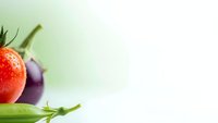 Fresh ripe strawberry with green leaves on soft gradient background. Healthy organic fruit for nutrition, diet and wellness concepts.