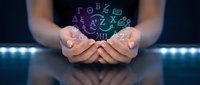 Hands holding glowing digital symbols and letters, representing data, technology, and innovation in computing and digital transformation concepts.