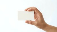Hand holding blank white business card mockup against clean background for branding and corporate identity design projects.