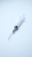 Medical syringe with needle on white background, suitable for healthcare, pharmaceutical, vaccination, and clinical educational materials.