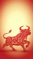 Red paper cut bull with floral patterns on gradient background for Chinese New Year celebration and zodiac decorations.
