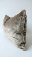 Luxurious taupe velvet throw pillow with soft sheen texture on white background, perfect for interior design and home decor styling projects.