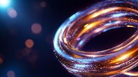 Glowing spiral ring with orange and blue light trails against dark background, magical energy flow effect with bokeh and sparkles for abstract design backgrounds.