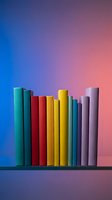 Colorful paper tubes arranged in ascending height pattern against vibrant gradient background for creative design projects and artistic compositions.