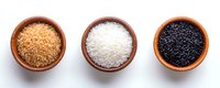 Three clay bowls with different rice varieties - brown, white and black grains arranged in row on white background. Isolated top view of raw cereals.