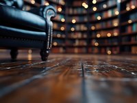 Rustic wooden floor with blurred bookshelf background and leather armchair detail. Cozy home library interior with warm bokeh lights creating atmospheric ambiance.