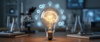 Glowing light bulb with a brain inside surrounded by gear and science icons on a laboratory desk, symbolizing innovation and creative thinking.
