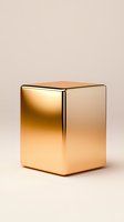 Metallic gold cube with reflective surface on neutral beige background, minimalist geometric shape for luxury product display and modern design concepts.