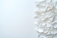 Crumpled white paper pieces creating abstract textural border composition against clean white background, minimalist artistic layout for design projects.
