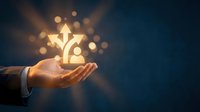Business hand holding glowing lightbulb with gear mechanism symbolizing innovation and creative problem-solving in corporate environment.