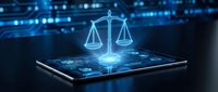 Digital justice scales hologram emerging from tablet screen with glowing blue technology background for legal tech and law firm applications.