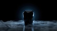 Sleek dark geometric object glowing with blue light surrounded by dramatic fog on a black background, evoking mystery and futuristic technology.