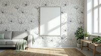 Modern living room interior with floral wallpaper, blank frame mockup, gray sofa, and houseplants near bright window for home decor design.