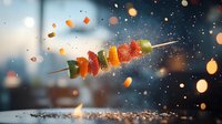 Colorful grilled vegetable kebab with water splash effect against dark background with bokeh lights, dramatic food photography with motion and spray.