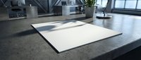 Blank white paper sheets on modern office desk with natural lighting for business documents and professional presentations.
