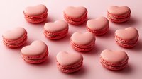 Heart shaped pink macarons arranged on pink background. Sweet French meringue cookies with romantic design for Valentine's day celebration or wedding dessert table.