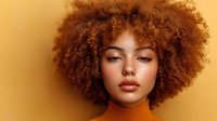 Young woman with voluminous natural afro hairstyle and warm copper-toned makeup against golden yellow background, wearing orange turtleneck sweater.