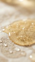 Water droplets on golden fabric with soft beige textile background, showcasing hydrophobic surface and moisture resistance for product protection and material testing concepts.