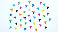 Colorful paper airplane collection scattered on white background. Vibrant origami planes in multiple colors perfect for creative projects and designs.