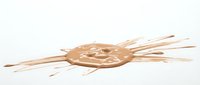 Isolated wooden decorative element with geometric pattern and radiating strands on white background, suitable for design projects, crafts, and artistic compositions.