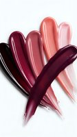 Colorful lipstick swatches in various shades from deep burgundy to soft pink creating artistic strokes on white background for beauty and cosmetics.