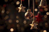 Festive Christmas ornaments hanging against dark background with bokeh lights, creating warm holiday atmosphere.