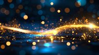 Glowing golden light trail with sparkles and bokeh effects against dark blue background, creating magical atmosphere for festive designs and celebrations.