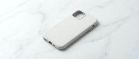 White smartphone case mockup on marble surface for branding and design presentation. Clean minimalist product photography for marketing materials.